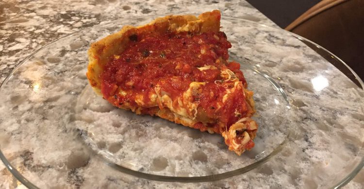 slice of deep dish pizza